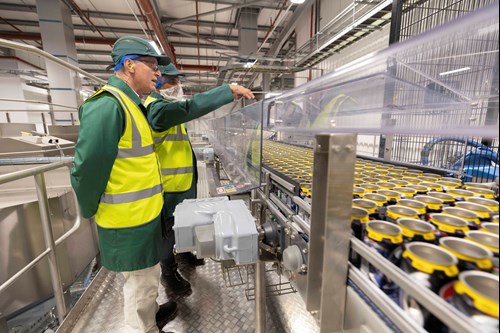 MP Mark Pawsey at Rugby being shown the canning line.