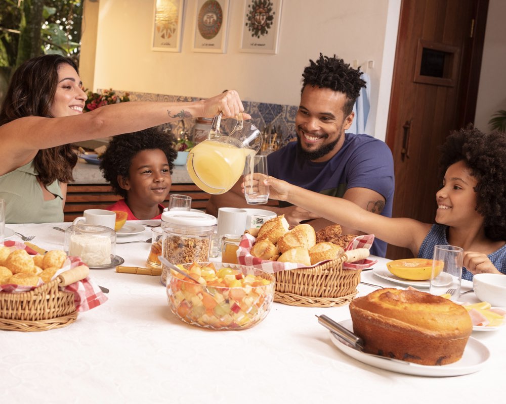 Family enjoying Britvic branded drinks around a table